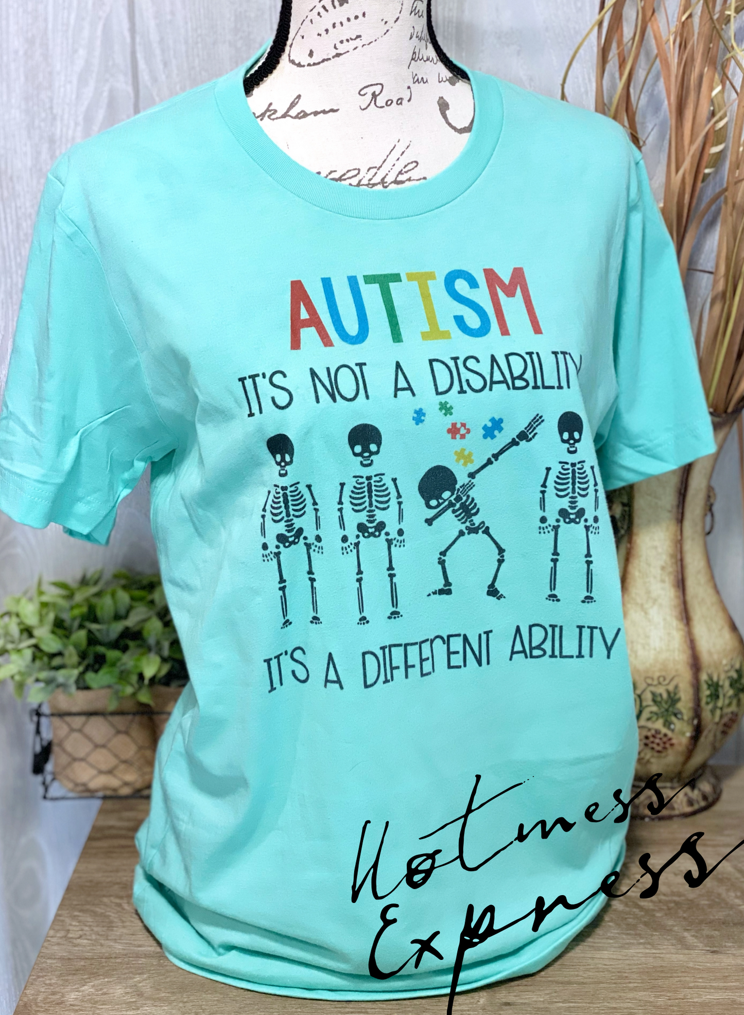 Autism isn’t a disability it’s a different ability Graphic Tee Autism Drop